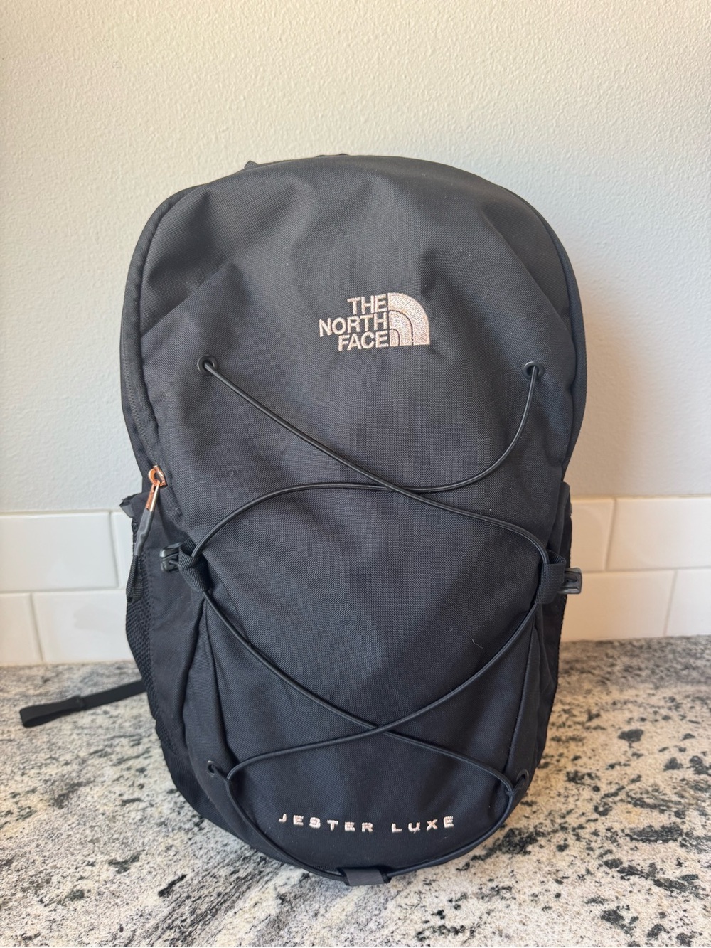 The North Face Jester Luxe Backpack in Black with rose gold accents. EUC!